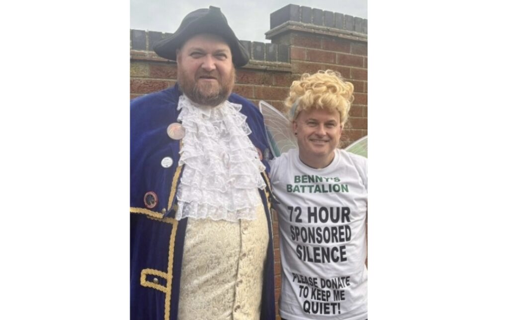 Kev Pitcher dressed as a fairy alongside the Town Crier of Sheringham