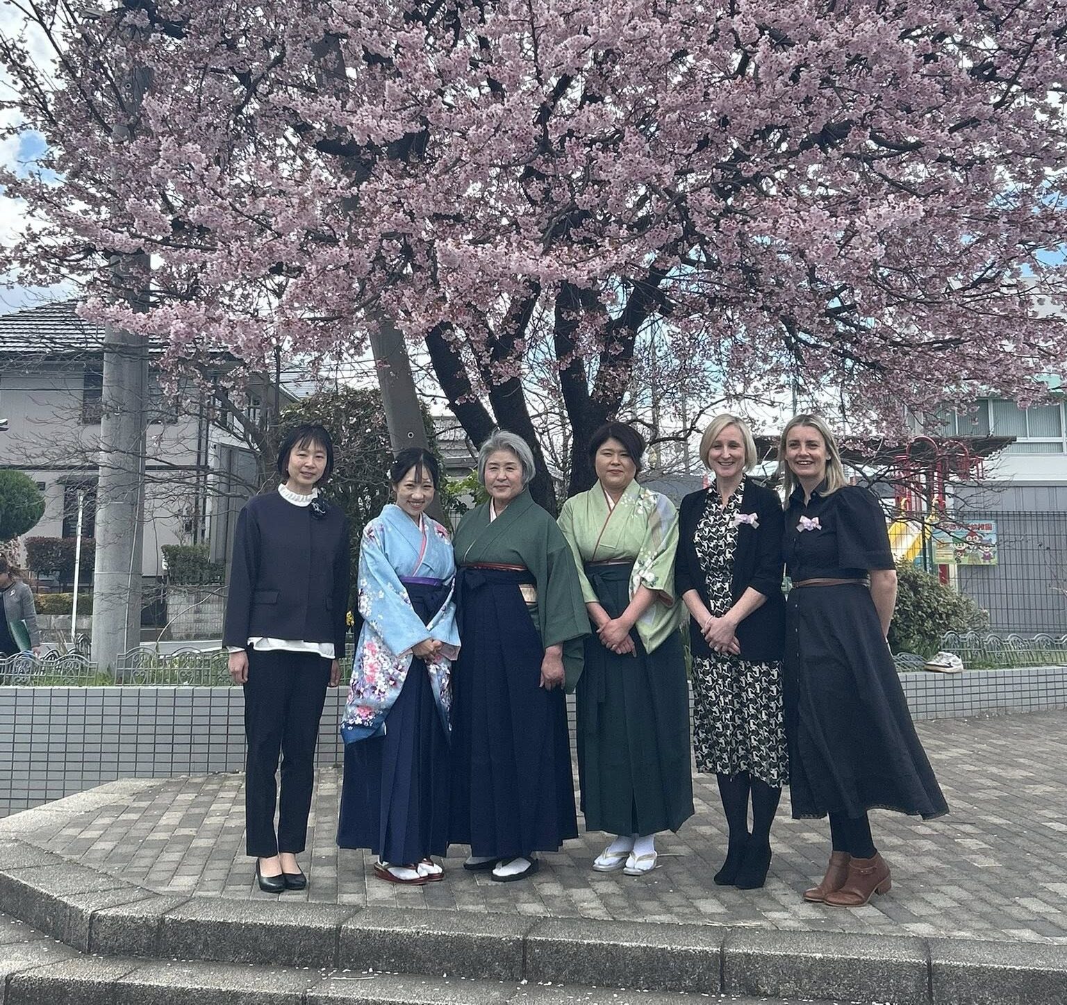 Caroline Henry and Amy Whitby (right) with counterparts from the Kindergarden.