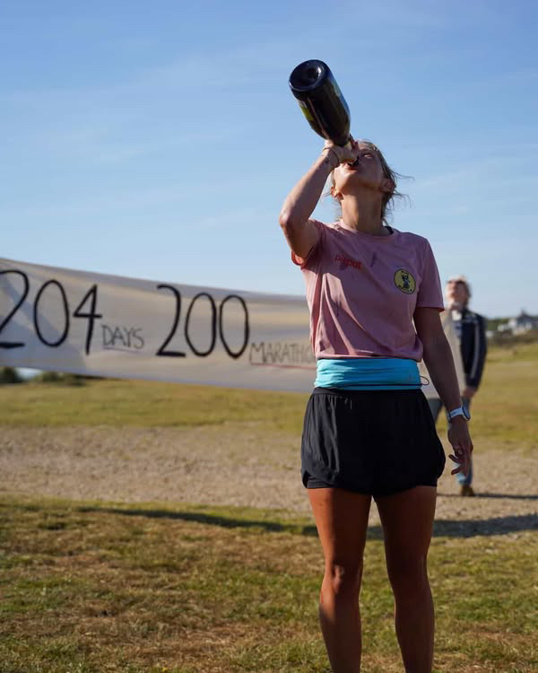 Megan Boxall has become the fastest woman to run the coastline of Britain, crossing the finish line in Sizewell, Suffolk