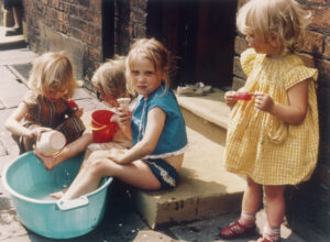 Shirley Baker, Four girls playing on pavement in Hulme, Manchester, 1965. Courtesy of Mary Evans Pictures Library.